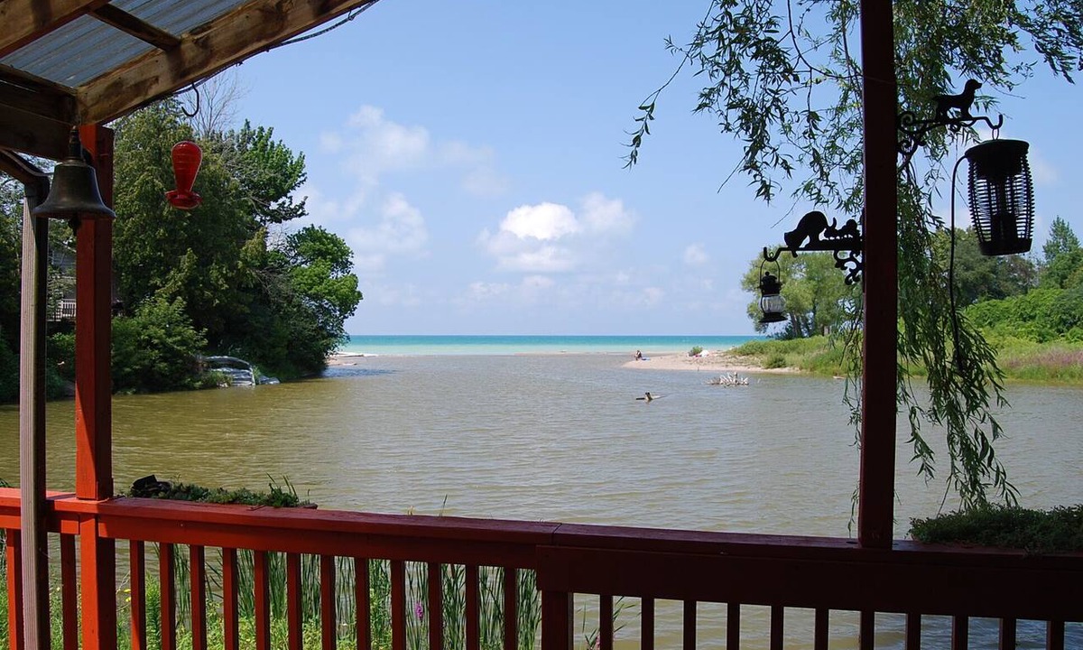 Port Albert Cottage | Cozy rustic cottage on Nine miles river, viw of Huron Lake sunset. Pet friendly