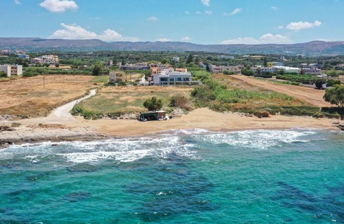 Sfakaki Villa | Beachfront Villa with Eco heated Pool, Hot Tub, Playroom and walk to restaurants