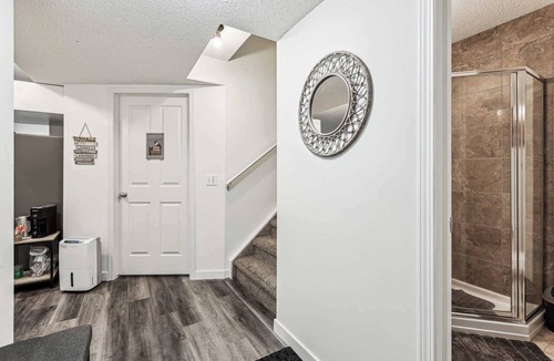 Cranston House | Charming Basement Suite with Parking & Laundry