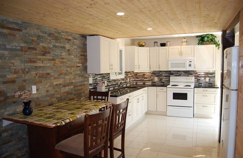 Port Albert Cottage | Cozy rustic cottage on Nine miles river, viw of Huron Lake sunset. Pet friendly
