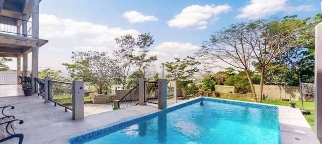 Enchanting home with pool, volleyball, mountain/city views & AC in San Ignacio