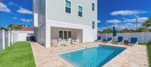Endless Summer Oasis heated pool and putting green in St. Augustine Beach