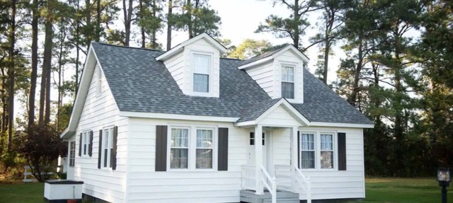 Mid-century modern meets classic cape on the coast. in Moon