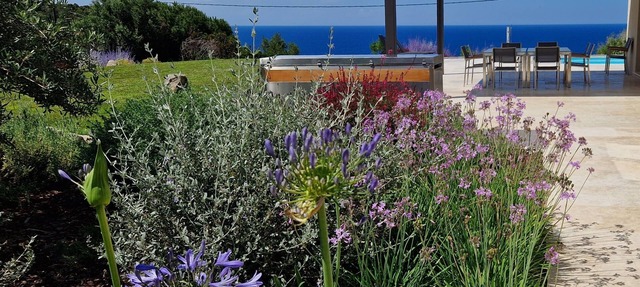 Modern single-story villa with ocean and mountain views, sleeps 10, heated pool in CORBARA