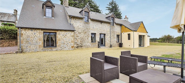 Spend a dream vacation in a spacious and modern property in Le Gast. in Courson