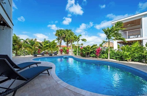 Marathon Villa | Canal Front with Large Custom Pool, Lush Landscaping, Hot Tub, 30' Dock, Kayaks!